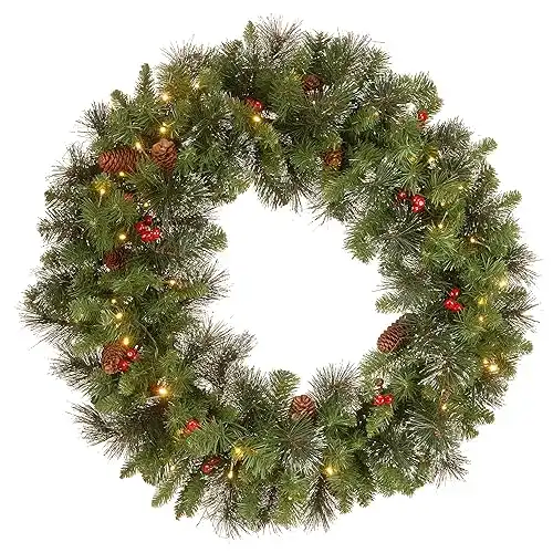 National Tree Company Pre-Lit Artificial Christmas Wreath, Green, Crestwood Spruce, White Lights, Decorated with Pine Cones, Berry Clusters, Frosted Branches, 30 Inches